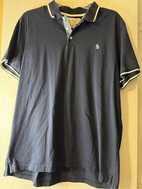Original Penguin size XL navy polo shirt features white contrast tipping